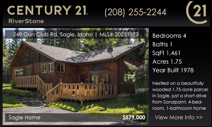 Nestled on a beautifully wooded 1.75-acre parcel in Sagle, just a short drive from downtown Sandpoint